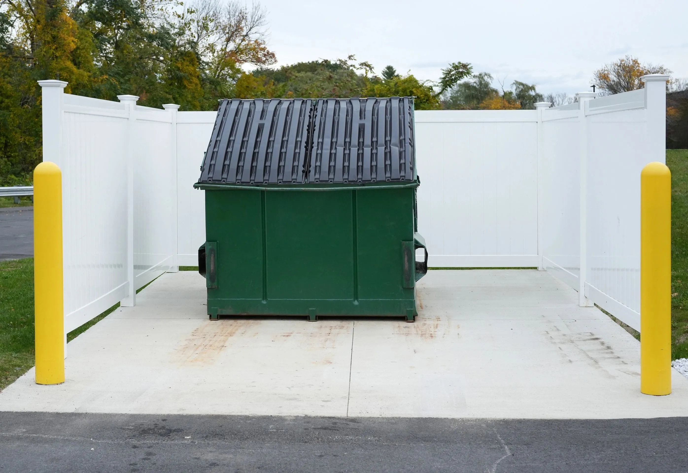 Clean, well-maintained dumpster enclosure at an apartment community